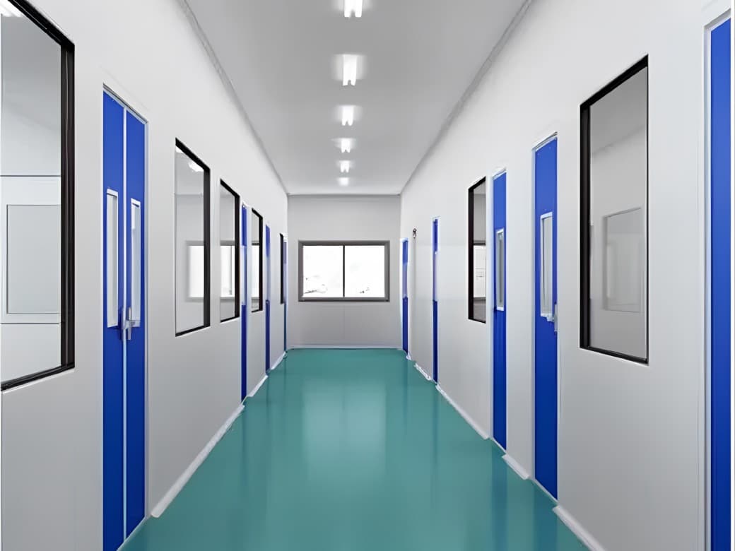 Modular clean room corridor with blue doors and partition panels